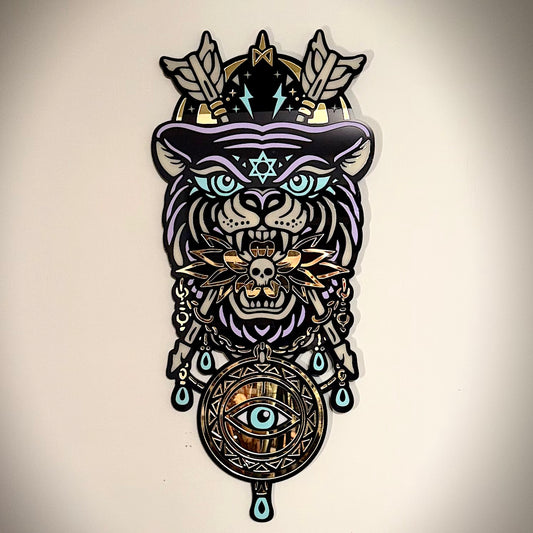 Decorative wall art with a stylized animal head design featuring symbols and patterns on a beige background.