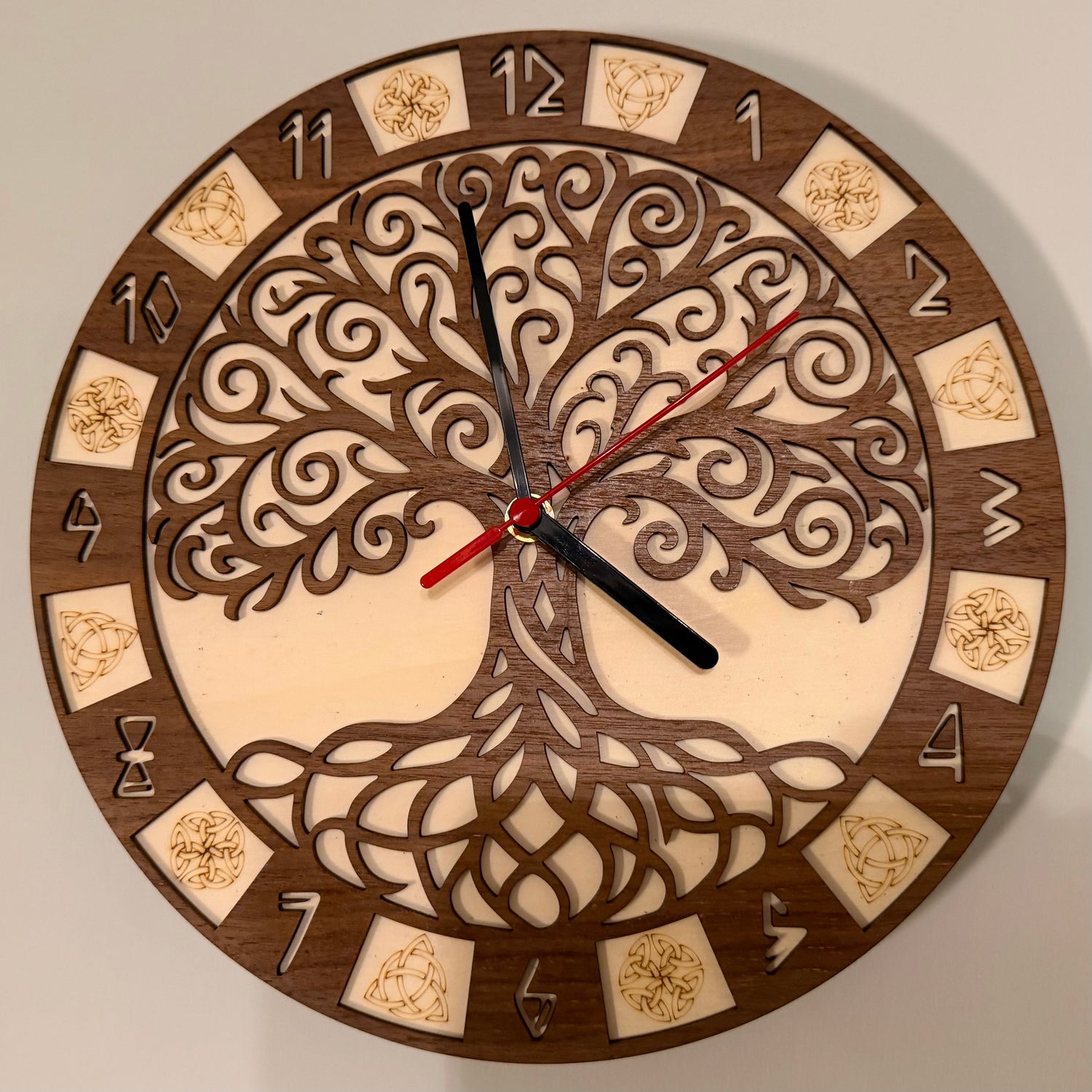 Laser-cut Yggdrasil wooden wall clock made from walnut and basswood ply with intricate Norse world-tree design – handcrafted décor by Sanctum Hex.