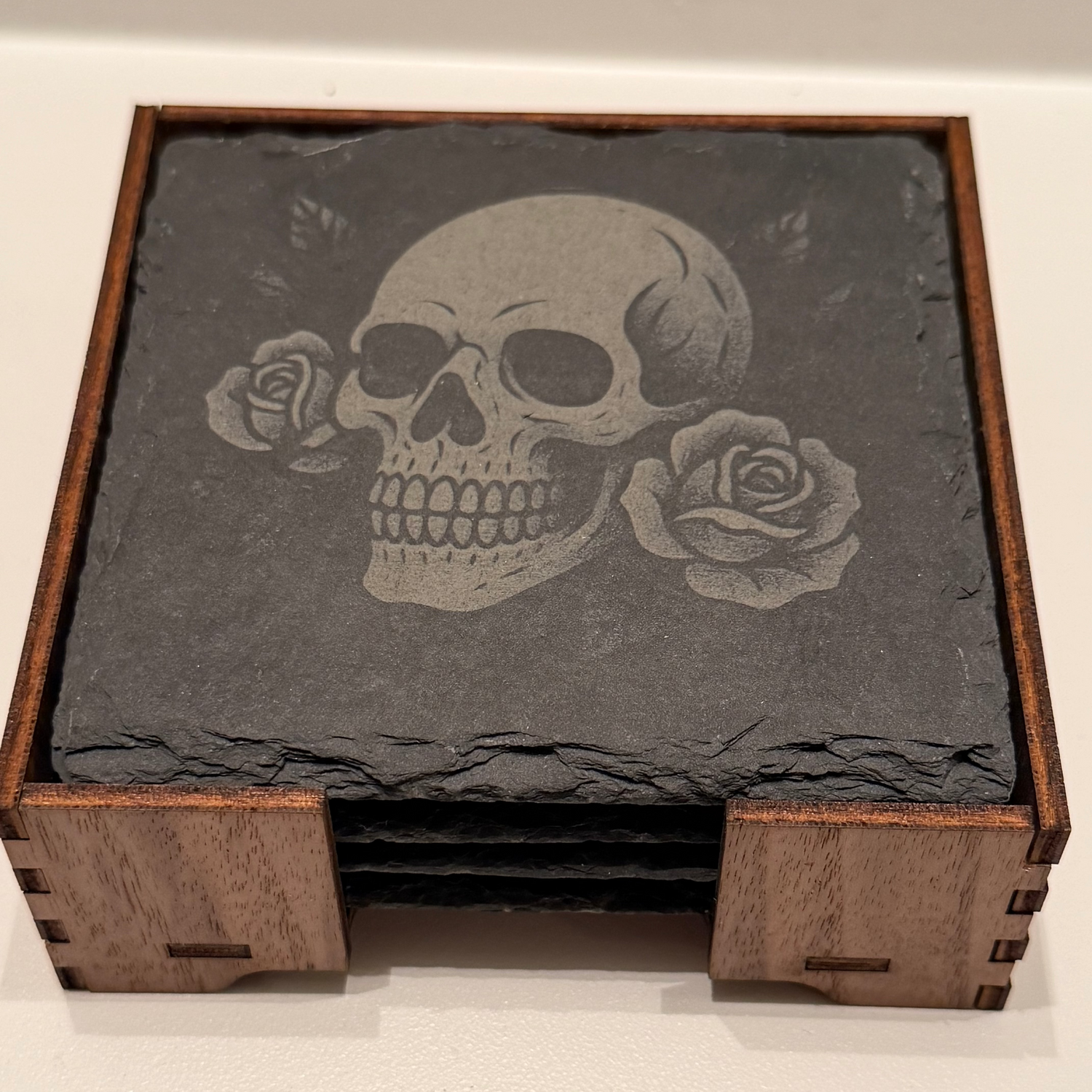 Tattooed Talisman slate coaster set with engraved  skull design in a wooden holder