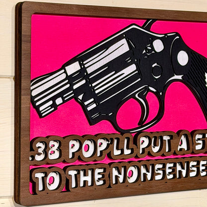 Angled view showing the layered wooden construction of the wall sign