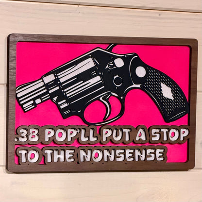 Perspective view of the layered wooden revolver wall sign