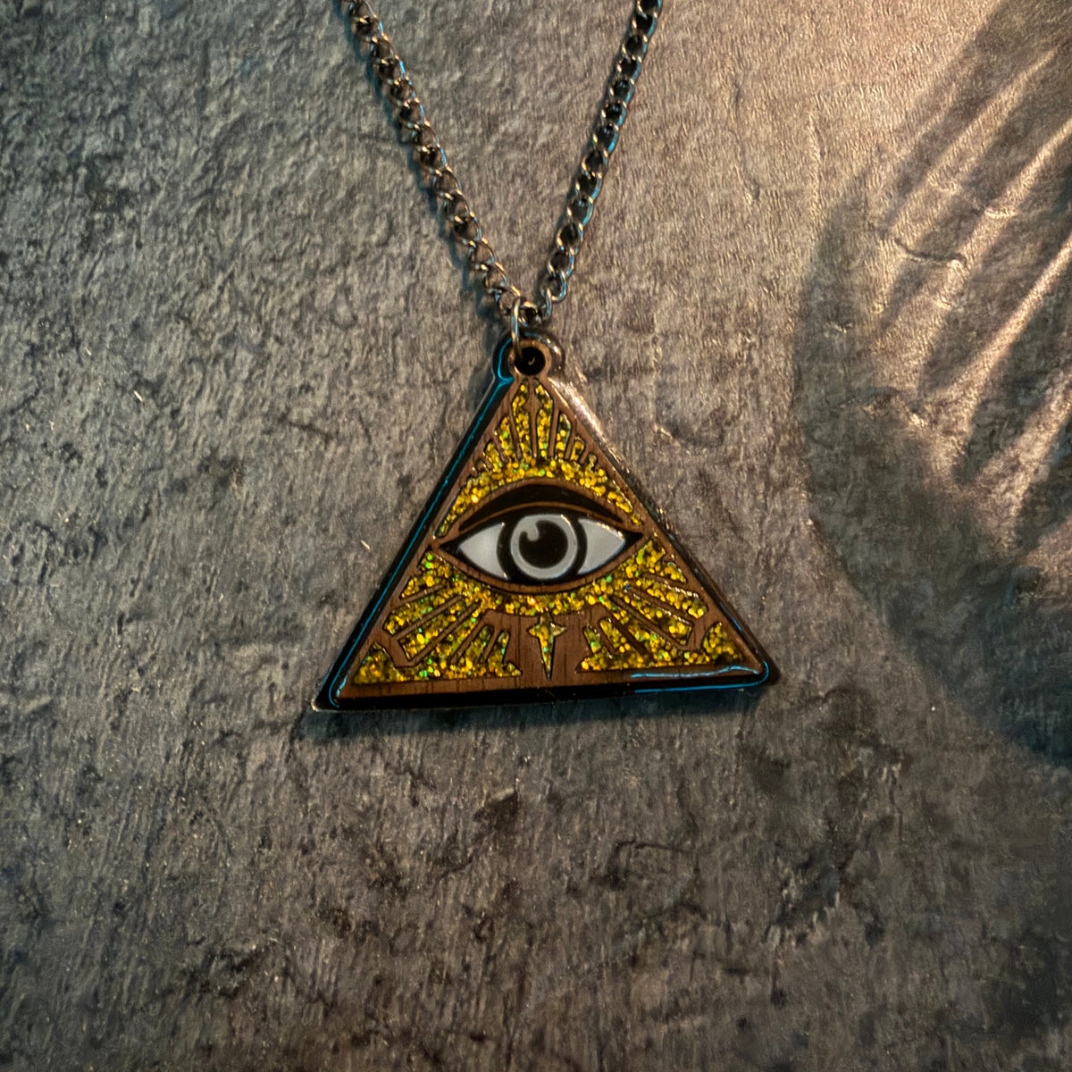 Sanctum Hex pyramid necklace with centred eye motif and glossy resin finish