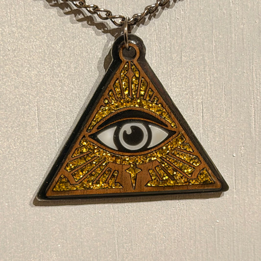 Handcrafted triangular all-seeing eye pendant with black details and gold glitter