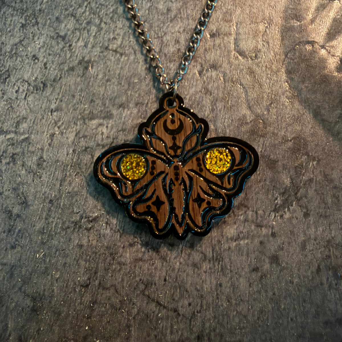Handcrafted moth necklace with walnut grain, gold glitter acrylic and glossy resin finish