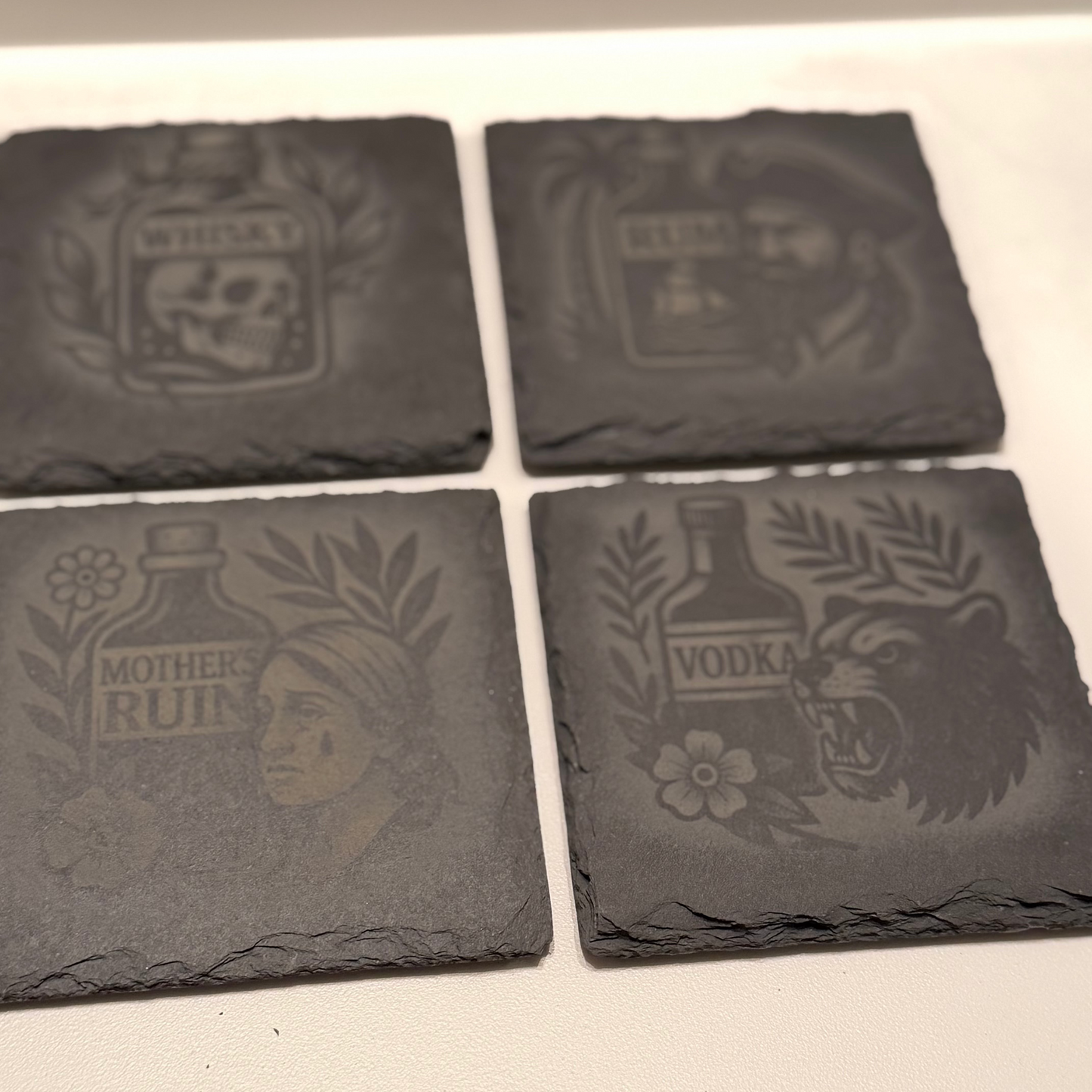 The Sinister Spirits Collection – Engraved Slate Coaster Quartet (with Holder)