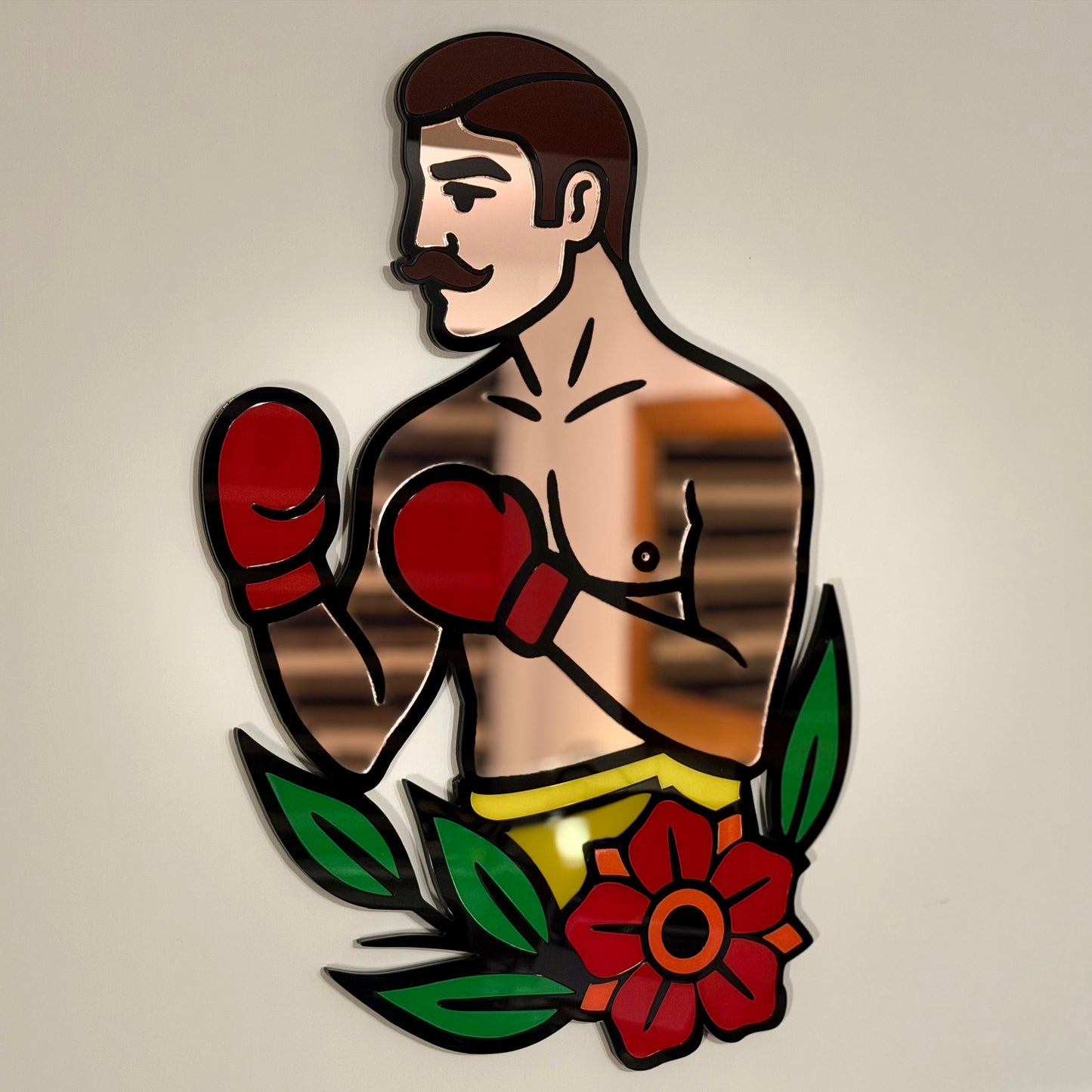 Detail shot of the boxer’s torso and red gloves highlighting precision‑cut lines and smooth mirror finish.