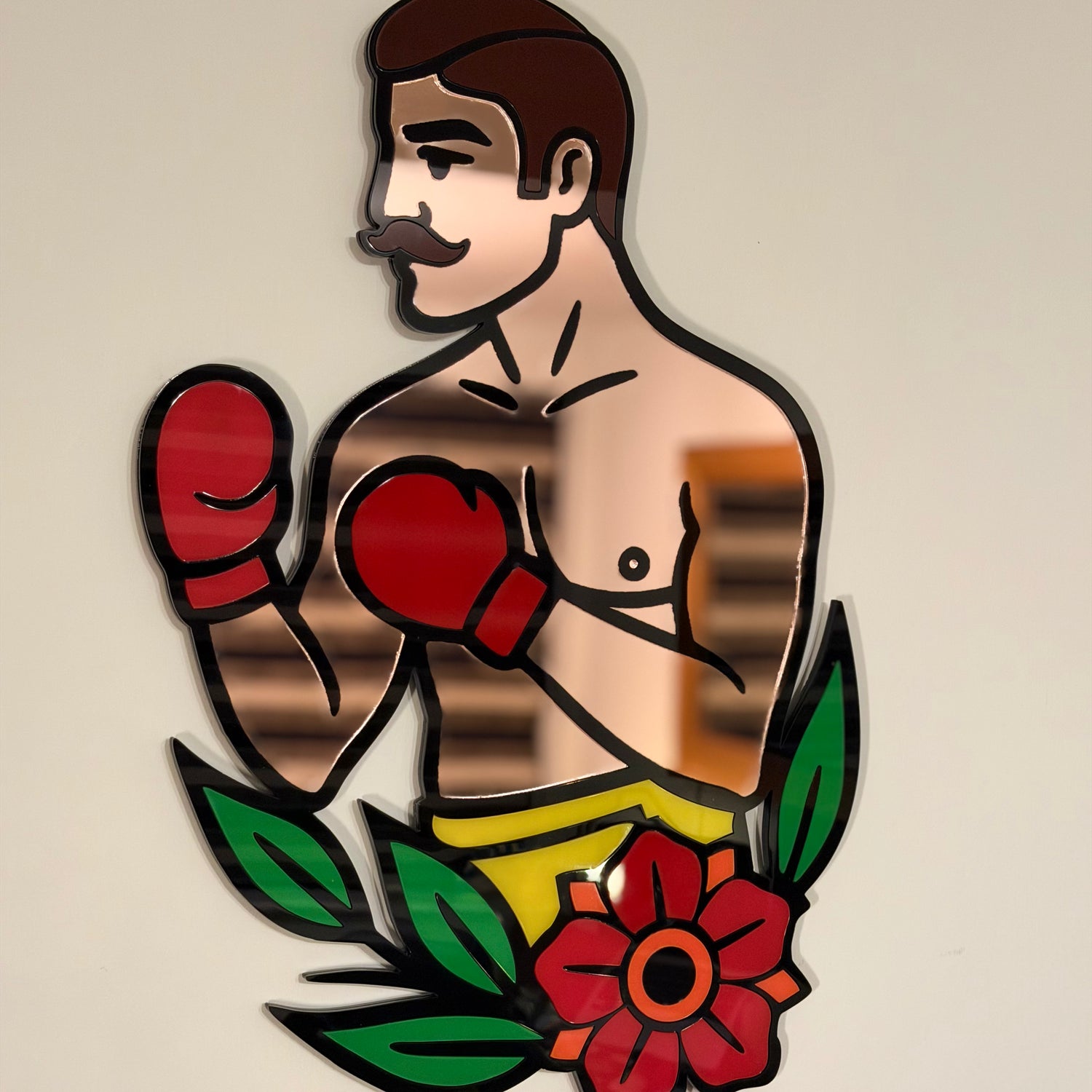 Full view of The Boxer acrylic wall hanging depicting an old‑school fighter with red boxing gloves, moustache and flower embellishment on a beige background.