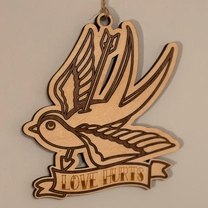 Swallow of Sorrow tattoo-style hanging charm with arrow motif — photo 1