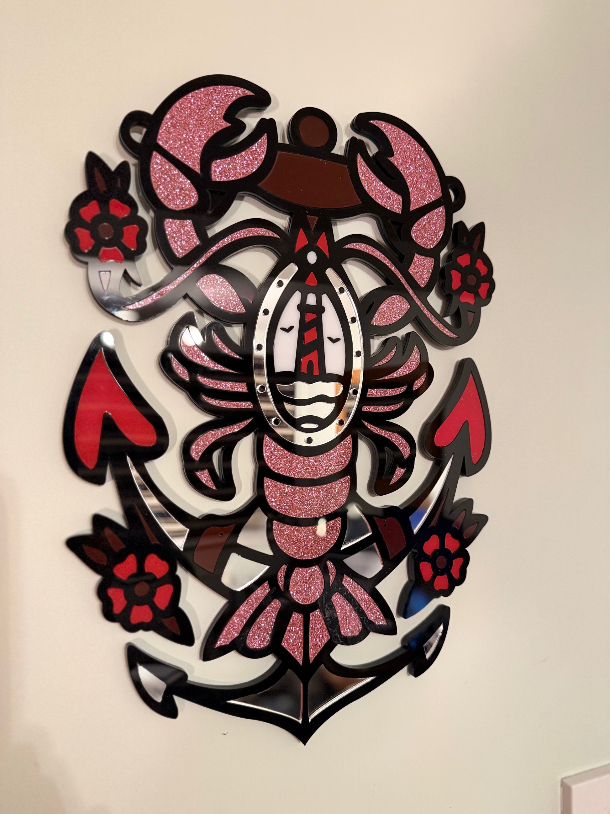 Side view highlighting the layered acrylic construction and glossy finish of the red, black, glitter pink and mirror tones.