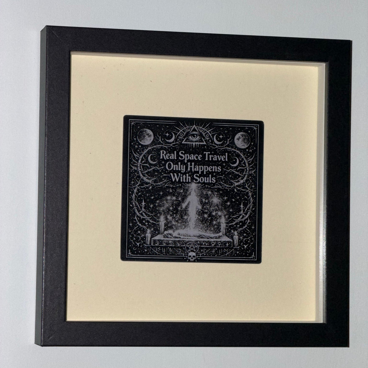 Real Space Travel — Framed Esoteric Art in black shadow-box frame, 18 cm square, with warm ivory backing and 95 mm engraved acrylic artwork
