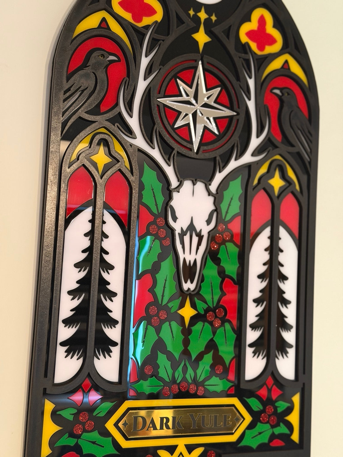 Close-up detail of Dark Yule gothic wall hanging showing ravens, antlers, skull and holly