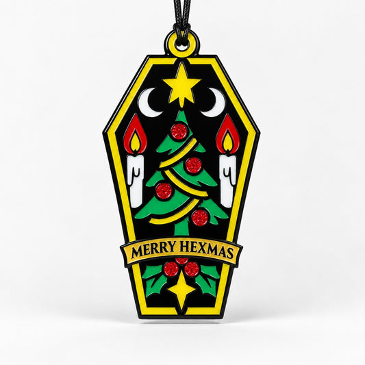 Merry Hexmas coffin ornament on a clean light background